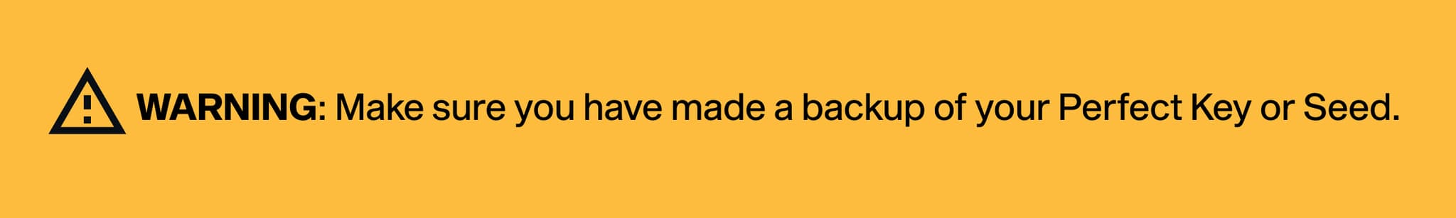 Yellow warning sign with text: "WARNING: Make sure you have made a backup of your Perfect Key or Seed."